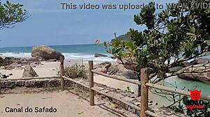Brazilian brunette Holly Bombom gets naughty on a nude beach